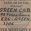 A sign on the passenger door in the first Green Cab. Chro...