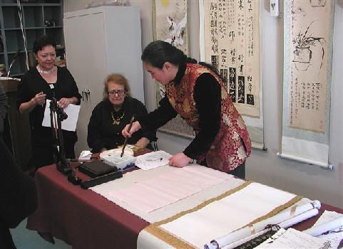 Aiqin Zhou demonstrates Chinese painting techniques