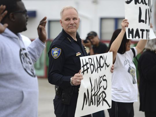 Richmond, Calif., Chief of Police Chris Magnus stands