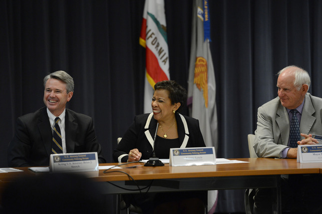 The United States Attorney General Loretta Lynch, center, shares a laugh with Richmond Mayor Tom butt, right and Acting U.S. Attorney Brian Stetch, left,