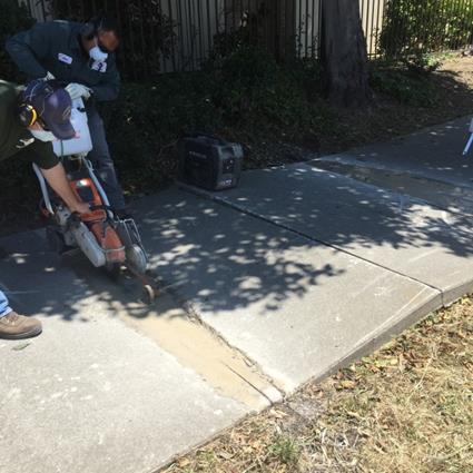 Saw cutting sidewalk repair (Marina)