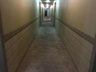 The unit at the end of this hallway is one of two where mold was found. (Photo by: Parker Yesko)