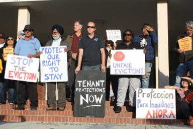 Richmond community members gathered for a press conference at Civic Center Plaza before Tuesday's special meeting to show their support for an urgency ordinance that would have implemented a 45-day ban on certain evictions and high rent increases. Photo by Abner Hauge.